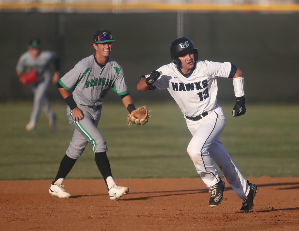 Hendrickson runner Alex Jimenez looks to steal against Brenham in the first game of a Class 5A area-round series Thursday. Brenham came back to win 5-4.