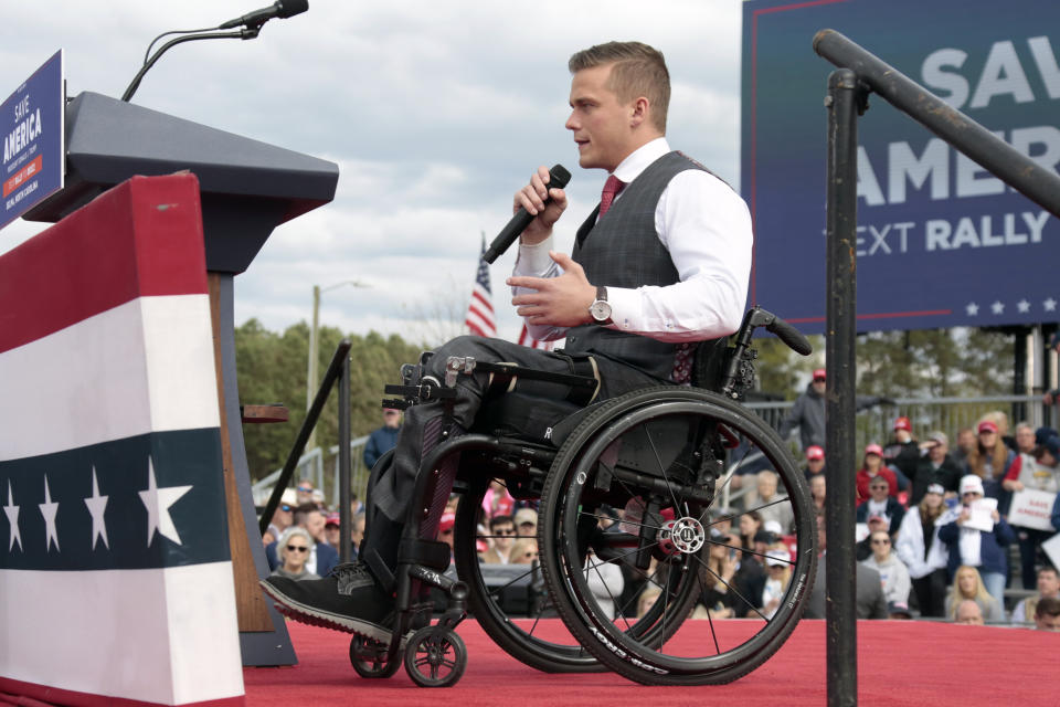 U.S. Rep. Madison Cawthorn, R-N.C., speaks before former President Donald Trump takes the stage at a rally, Saturday, April 9, 2022, in Selma, N.C. (AP Photo/Chris Seward)