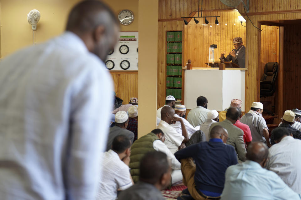 An imam leads Friday prayers at the Dar Al-Hijrah mosque in Minneapolis on Thursday, May 13, 2022. During the pandemic lockdown in spring 2020, the mosque was given a special permit to broadcast the prayer for the Muslim holy month of Ramadan. That led to a recent resolution authorizing mosques to broadcast the adhan three times a day. (AP Photo/Jessie Wardarski)