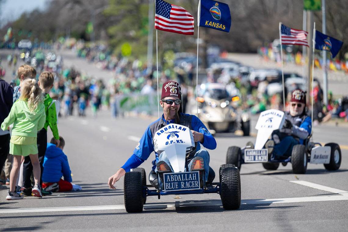 Members of the Overland Park Shriners drove mini racers along Johnson Drive during the 38th annual Shawnee St. Patrick’s Day Parade on Sunday, March 10, 2024, in downtown Shawnee.