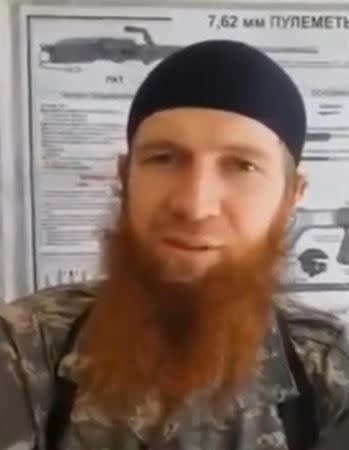 A still image taken on July 14, 2016 from an undated video posted on social media, shows Islamic State senior operative Abu Omar al-Shishani being interviewed in an unknown location. Social Media