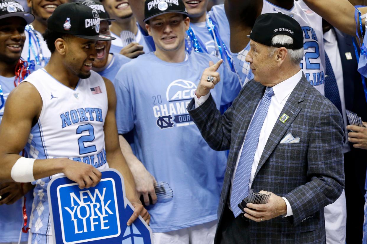 Mar 12, 2016; Washington, DC, USA; North Carolina Tar Heels head coach Roy Williams celebrates with Tar Heels guard Joel Berry II (2) after their game against the Virginia Cavaliers in the championship game of the ACC conference tournament at Verizon Center. The Tar Heels won 61-57. Mandatory Credit: Geoff Burke-USA TODAY Sports