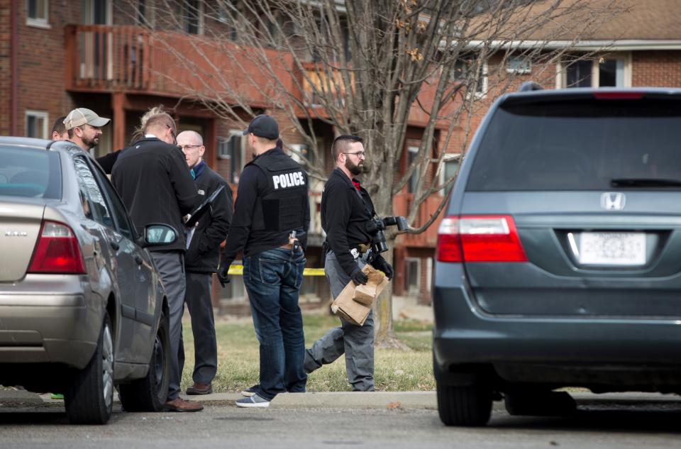 Police block off an area at an apartment complex along West White River Boulevard with crime scene tape after a shooting on Jan. 9, 2020.