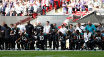 NFL Football - Jacksonville Jaguars vs Baltimore Ravens - NFL International Series - Wembley Stadium, London, Britain - September 24, 2017 Jacksonville Jaguars players kneel during the U.S. national anthem before the match Action Images via Reuters/Paul Childs