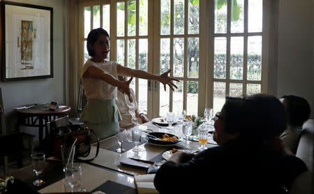 Philippine Environment Secretary Regina Lopez belts a tune from her favourite song "I Believe I Can Fly" during a meeting in Manila, Philippines February 9, 2017. REUTERS/Erik De Castro