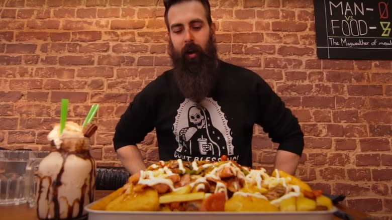 Adam Moran, Beard Meats Food, at the Undefeated Meat Mountain Challenge at Tavassoli's Cafe and Grill in Leeds, United Kingdom