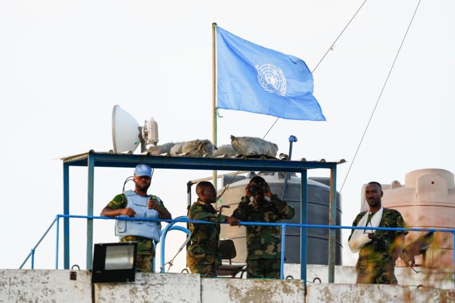 U.N. peacekeepers stand atop a watchtower in the southern village of Marwaheen, Lebanon, Thursday, Oct. 12, 2023. (AP Photo/Hassan Ammar)