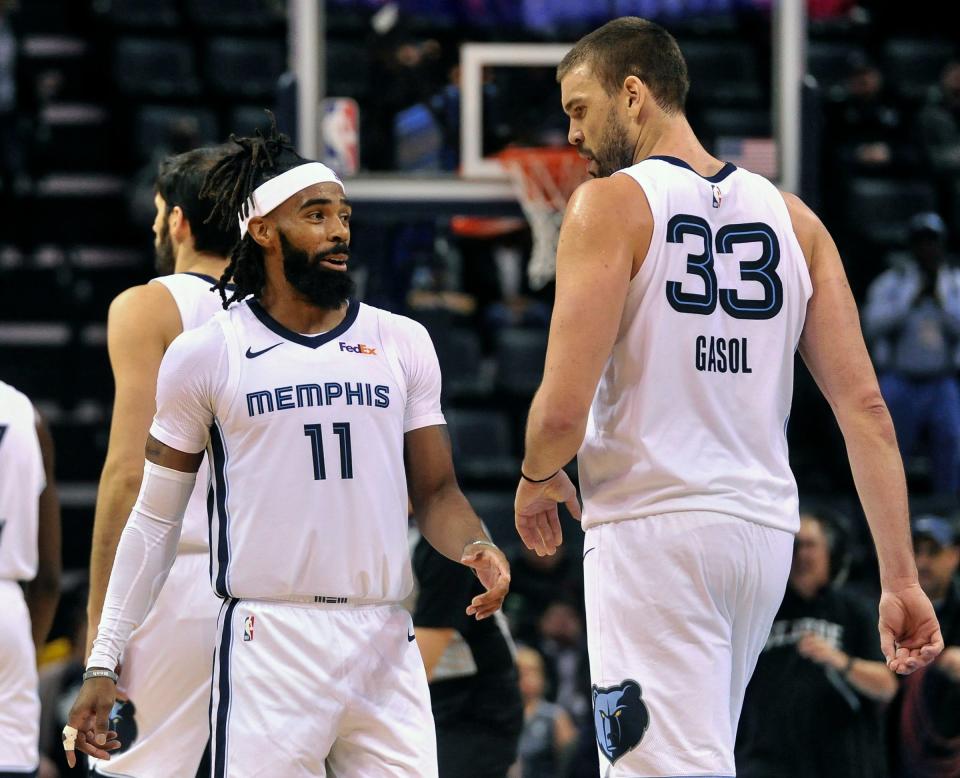 Memphis Grizzlies guard Mike Conley and center Marc Gasol talk during the game against the Charlotte Hornets, Jan. 23, 2019, in Memphis, Tenn.