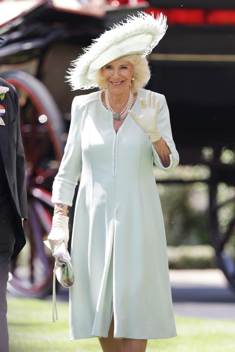 Queen Camilla attends day three of Royal Ascot wearing a light blue coatdress and mint hat