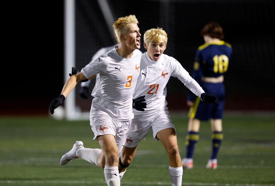 Churchville-Chili’s Elijah Bailey (3) celebrates with teammate Christopher Keller after scoring the winning goal in overtime to beat Spencerport 3-2 and win the Section V Class AA title.