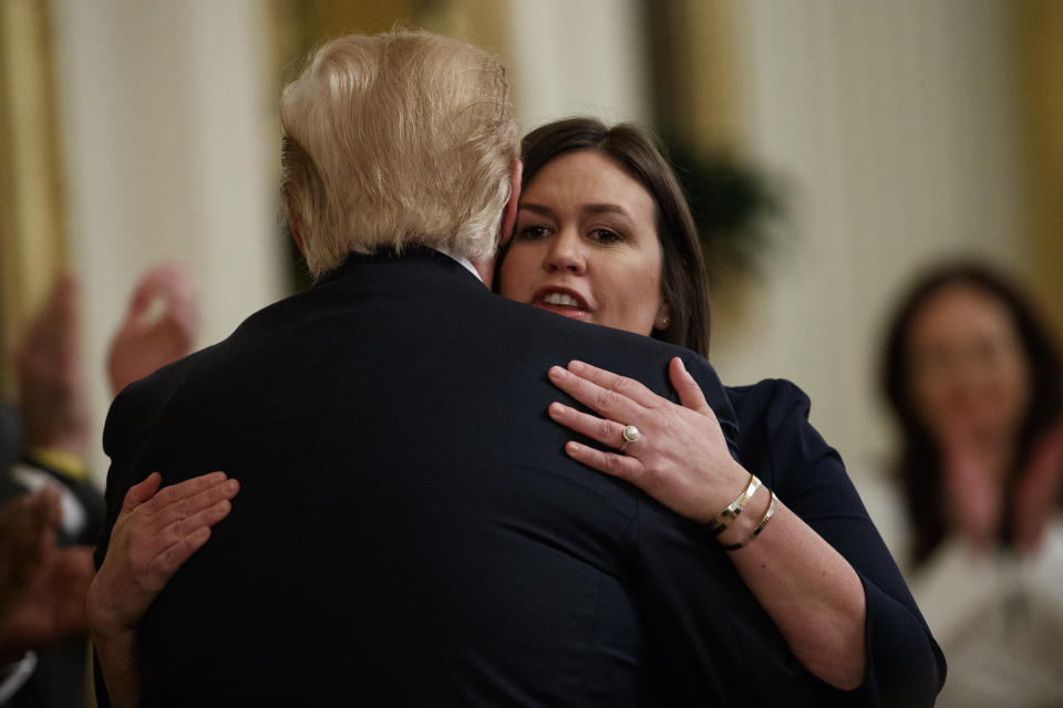White House press secretary Sarah Sanders hugs President Donald Trump after announcing she will be leaving her position during an event on second chance hiring and criminal justice reform in the East Room of the White House, Thursday, June 13, 2019, in Washington. (AP Photo/Evan Vucci)