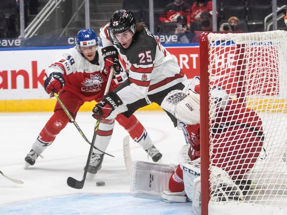 Owen Power (25) became the first Canadian defenceman to score a hat trick in a world junior tournament when he scored three against the Czech Republic in December. (Jason Franson/Canadian Press - image credit)