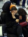 <p>Unidentified relatives of sailors who were onboard ‘Sanchi’ oil tanker that sunk off the coast of China mourn inside the Iranian company in Tehran, Iran, Jan. 14, 2018. (Photo: EFE/EPA/Abedin Taherkenareh) </p>