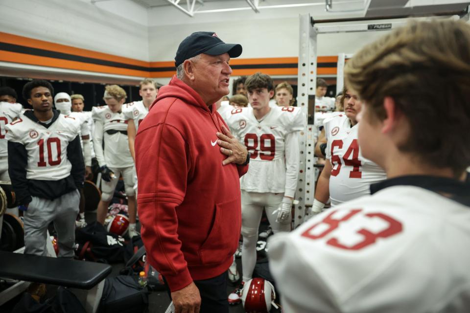 Owasso coach Bill Blankenship speaks to his team before their football game against Norman Friday, Nov. 3, 2023 in Norman, Ok.