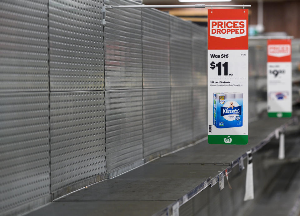 Empty shelves normally stocked with toilet paper rolls at Woolworths Supermarket in Sydney. Source: AAP