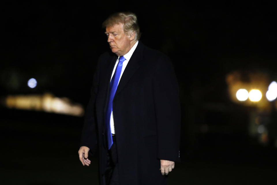 President Donald Trump crosses the South Lawn on his return to the White House, Saturday Oct. 13, 2018, in Washington, after a trip to Kentucky. (AP Photo/Jacquelyn Martin)