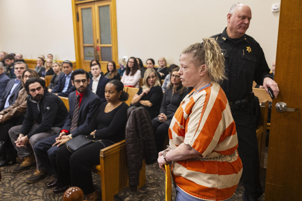 Victims, family members and friends watch as Mandy Benn enters the court room for sentencing at Ionia County Courthouse in Ionia, Mich., Tuesday, Dec. 12, 2023. Benn struck bicyclists that were riding in a July 2022 fundraiser for Make-A-Wish Foundation. Two cyclists Edward Erickson, 48, of Ann Arbor, and Michael Salhaney, 57, of Bloomfield Hills, died from the crash. (Joel Bissell/MLive.com/Kalamazoo Gazette via AP)
