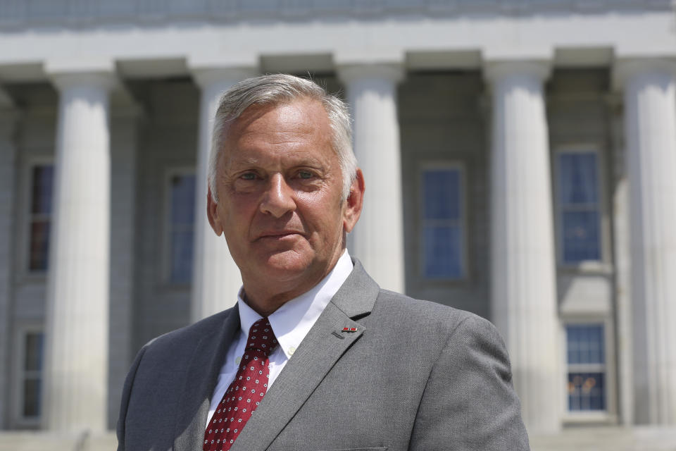 Retired U.S. Army officer Gerald Malloy, who is seeking the Republican nomination to run for Vermont's vacant U.S. Senate seat in November, poses in front of the Vermont Statehouse, in Montpelier, Aug. 3, 2022. Malloy, from Perkinsville, describes himself as a conservative Republican who is willing to work with anyone to get things done. (AP Photo/Wilson Ring)