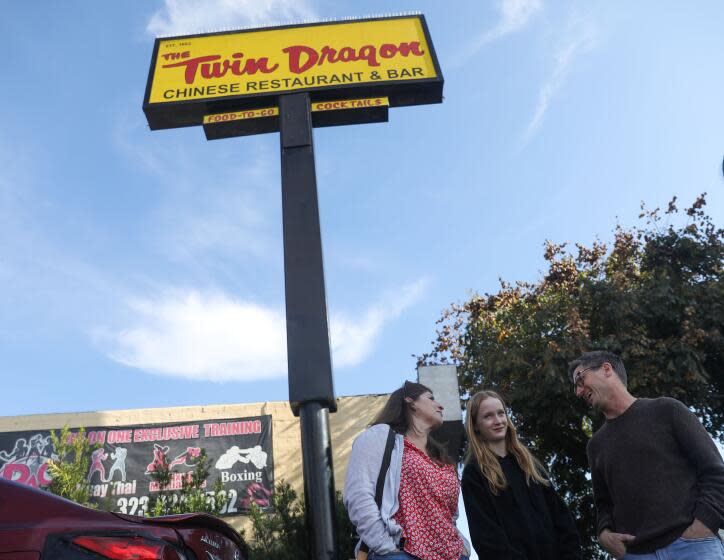 Los Angeles, CA - December 25: (From left) Allyn Woghin, 49, Lucy Gleim, 12, and Robert Gleim, 57, have dinner at Twin Dragon on Monday, Dec. 25, 2023 in Los Angeles, CA. (Michael Blackshire / Los Angeles Times)