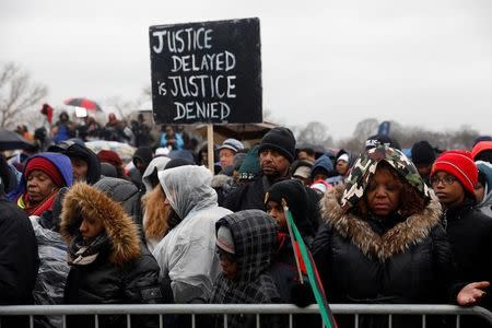 Activists pray during the National Action Network's "We Shall Not Be Moved" march in Washington, DC, U.S., January 14, 2017. REUTERS/Aaron P. Bernstein