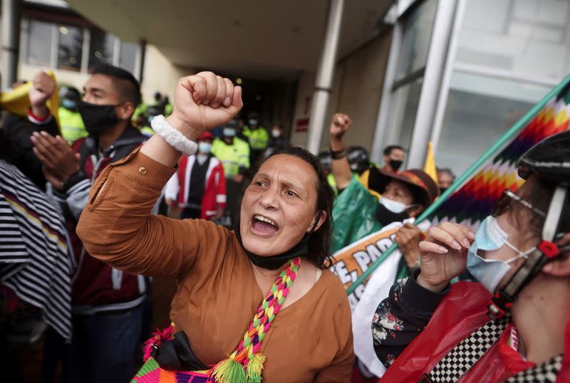 Demonstrators gather outside a local hotel where representatives of the Inter-American Commission on Human Rights (CIDH) and union leaders meet, in Bogota