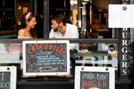 People dine at a cafe after coronavirus disease restrictions were eased in Melbourne