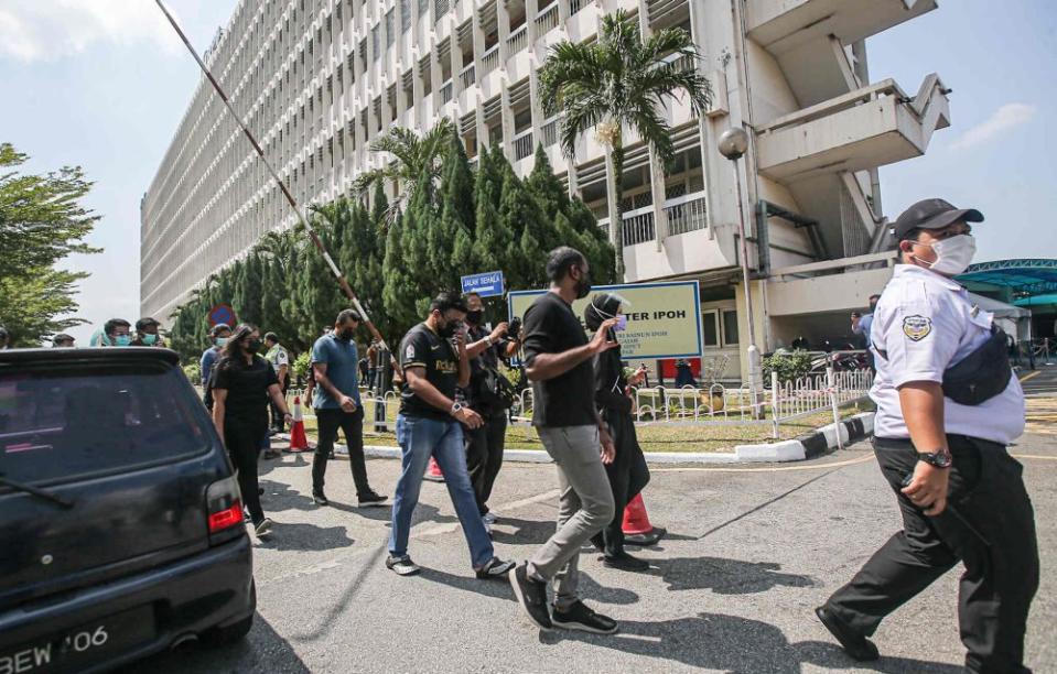 Doctors walk out of the Raja Permaisuri Bainun Hospital in support o f#HartalContractDoctors in Ipoh July 26, 2021. — Picture by Farhan Najib