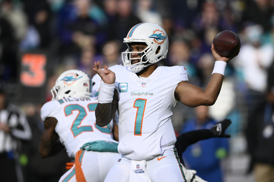 Miami Dolphins quarterback Tua Tagovailoa (1) looks to pass against the Baltimore Ravens during the first half of an NFL football game in Baltimore, Sunday, Dec. 31, 2023. (AP Photo/Nick Wass)