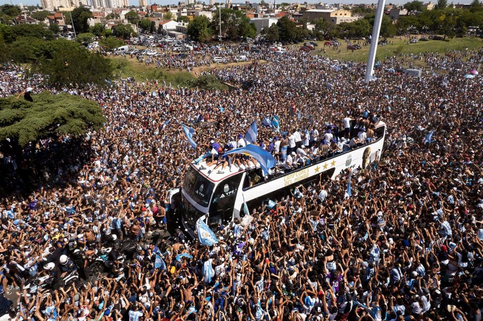 The Argentine soccer team that won the World Cup title ride on an open bus during their homecoming parade in Buenos Aires, Argentina