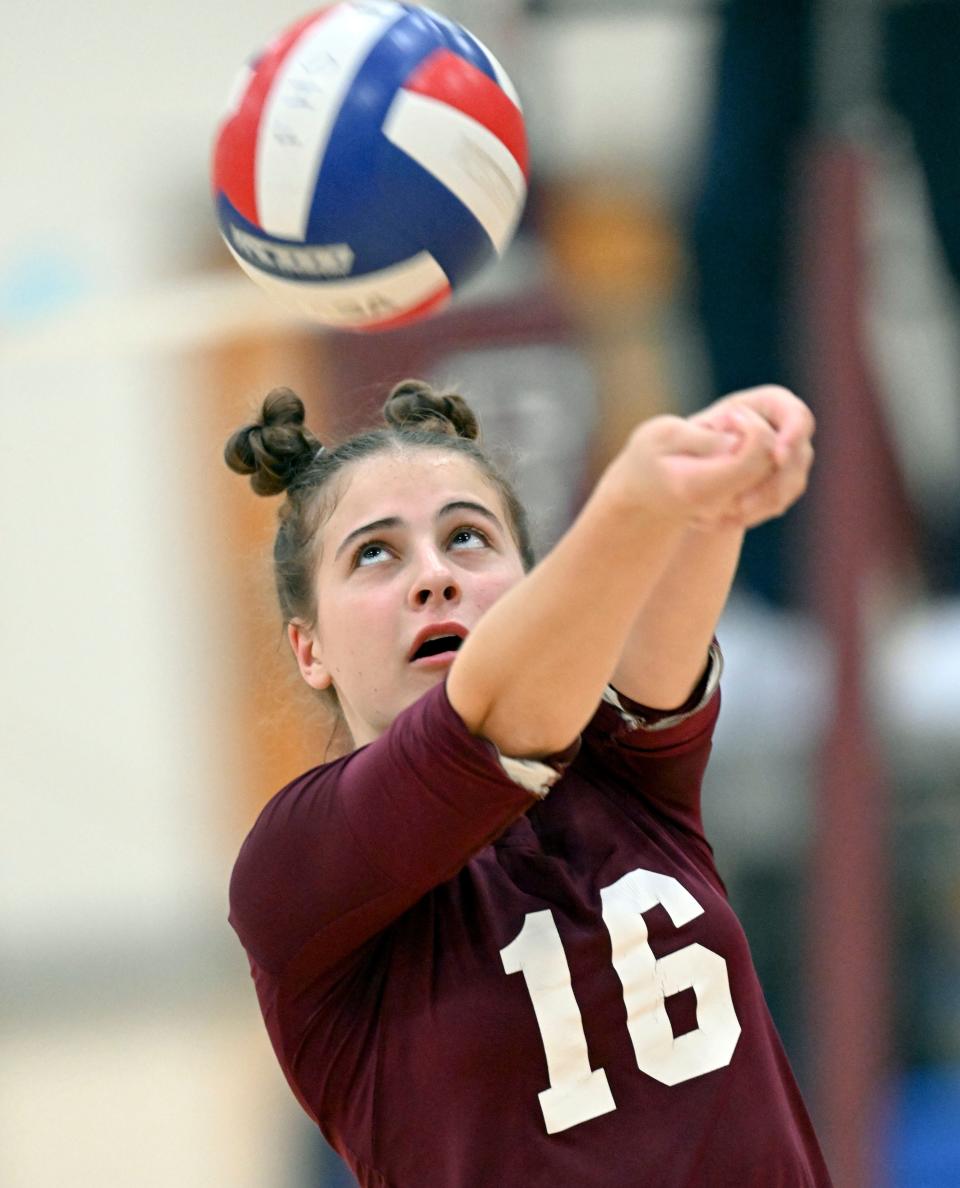 Christina Femino of Falmouth pushes the ball over against Nauset.