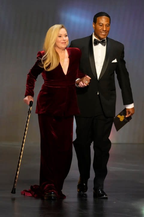 Christina Applegate, left, appears during the 75th Primetime Emmy Awards on Monday, Jan. 15, 2024, at the Peacock Theater in Los Angeles. (AP Photo/Chris Pizzello)