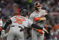 Baltimore Orioles' Gunnar Henderson, right, is congratulated by Adley Rutschman (35) after hitting a solo home run against the Washington Nationals during sixth inning of a baseball game at Nationals Park in Washington, Wednesday, May 8, 2024. (AP Photo/Susan Walsh)