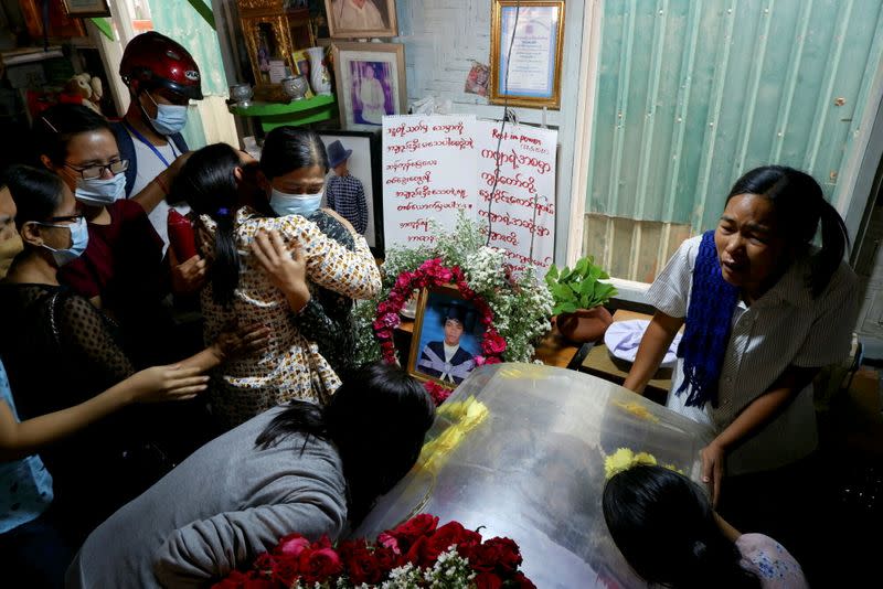 People mourn as they attend the funeral of Kyaw Win Maung, who was shot and killed during a protest against the military coup, in Mandalay