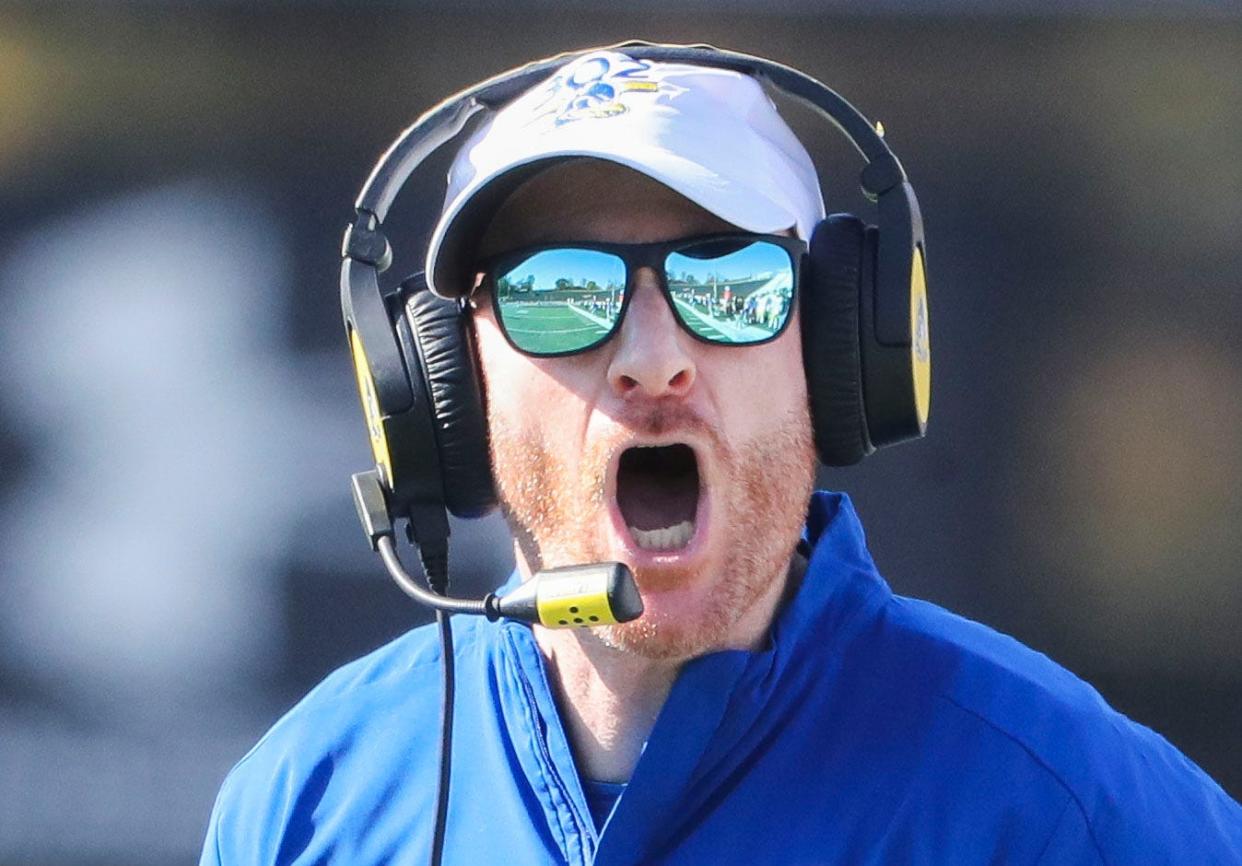 Delaware head coach Ryan Carty questions the clock not moving late in the second quarter against Towson at Johnny Unitas Stadium in Towson, Md., Saturday, Oct. 28, 2023.