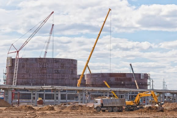 Oil storage tanks under construction.