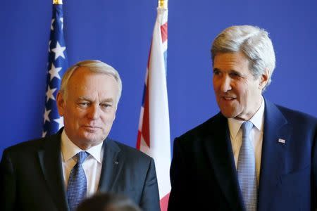 French Foreign Minister Jean-Marc Ayrault (L) and U.S. Secretary of State John Kerry attend a news conference after meeting over the crisis in the Mideast, at the Quai d'Orsay ministry in Paris, France, March 13, 2016. REUTERS/Gonzalo Fuentes