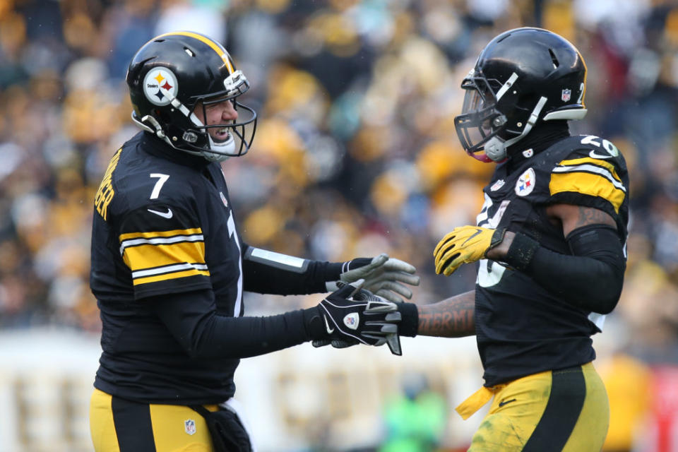 Jan 8, 2017; Pittsburgh, PA, USA; Pittsburgh Steelers quarterback Ben Roethlisberger (7) celebrates with Pittsburgh Steelers running back Le'Veon Bell (26) after a touchdown against the Miami Dolphins during the first half in the AFC Wild Card playoff football game at Heinz Field. Mandatory Credit: Geoff Burke-USA TODAY Sports