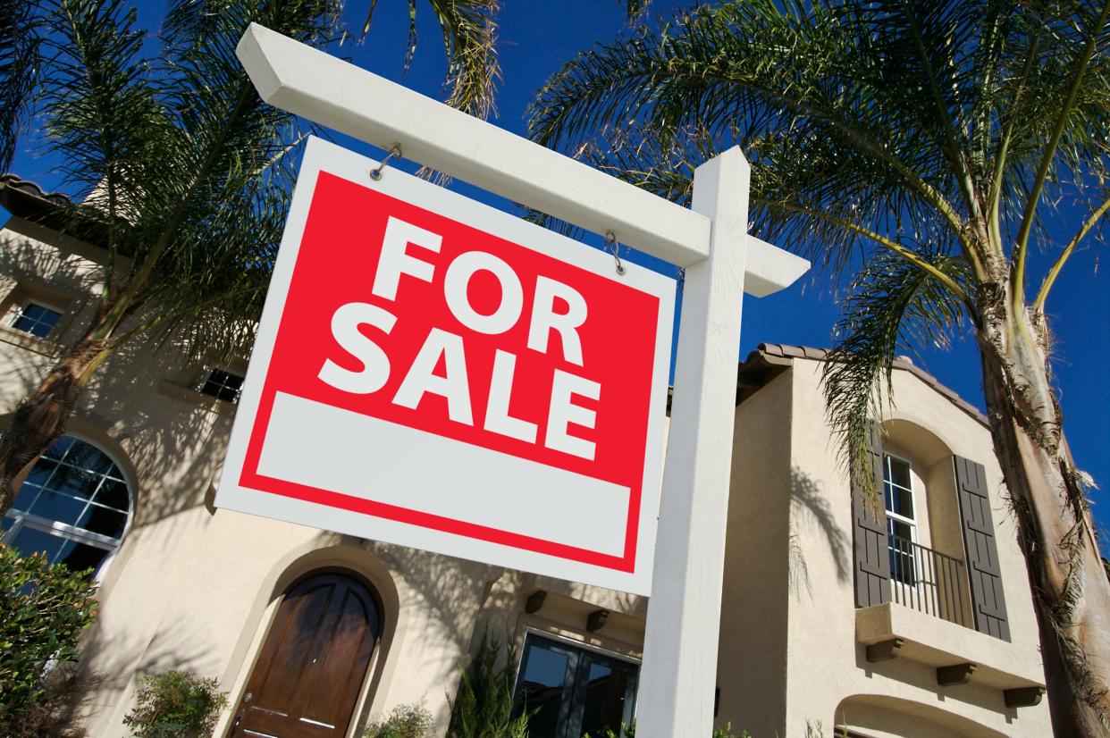 Home For Sale Sign and New House stock photo