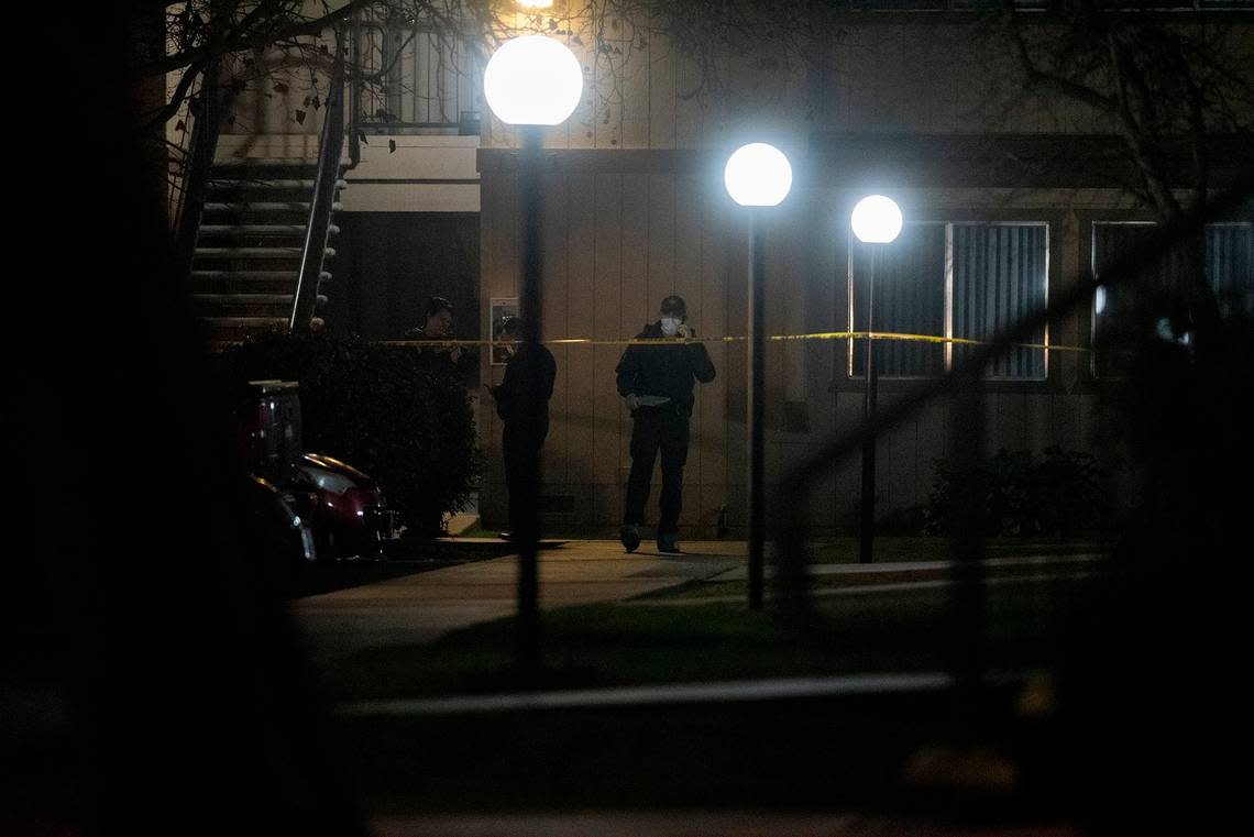 Merced County Sheriff’s Office deputies are shown investigating after three children were found dead inside a residence at an apartment complex in Le Grand, Calif., on Wednesday, Jan. 12, 2022.