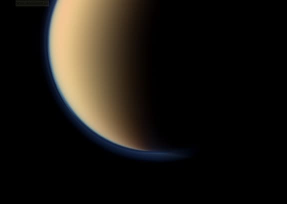 This view shows a close up of toward the south polar region of Saturn's largest moon, Titan, and show a depression within the moon's orange and blue haze layers near the south pole. NASA’s Cassini spacecraft snapped the image on Sept. 11, 201
