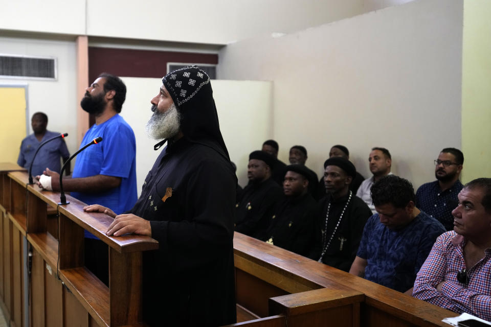 Two suspects appear at the magistrate court in Cullinan, a town east of Pretoria, South Africa, Thursday, March 14, 2024. The two suspects appeared at the court for the murder of three Egyptian monks belonging to the Coptic Orthodox Church at a monastery in South Africa. (AP Photo/Themba Hadebe)