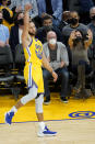 Golden State Warriors guard Stephen Curry (30) watches his 3-point basket against the Minnesota Timberwolves during the second half of an NBA basketball game in San Francisco, Thursday, Jan. 27, 2022. (AP Photo/Jeff Chiu)