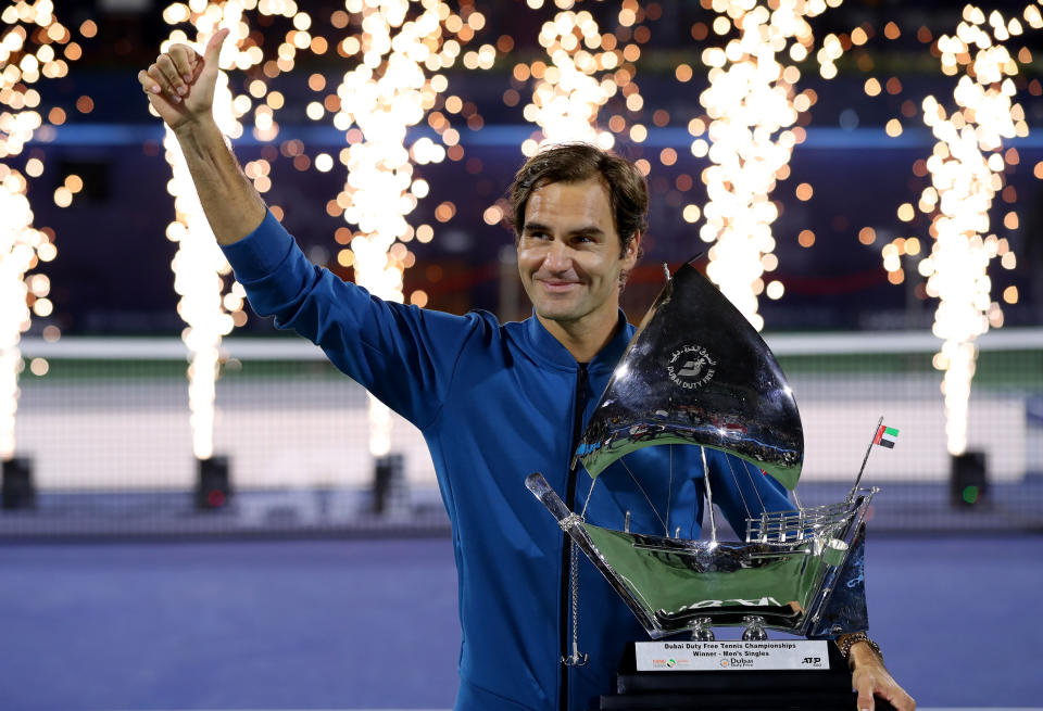 Roger Federer poses with the winners trophy after victory during day fourteen of the Dubai Duty Free Championships at Tennis Stadium on March 02, 2019 in Dubai, United Arab Emirates.