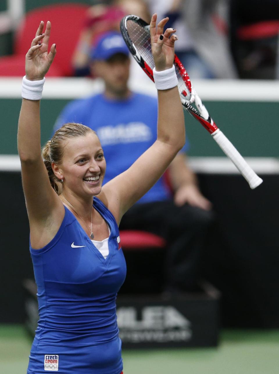 Czech Republic's Petra Kvitova after defeating Italy's Roberta Vinci in their Fed Cup semifinal tennis match in Ostrava, Czech Republic, Sunday, April 20, 2014. Kvitova won the match and gave Czech Republic a decisive 3-0 lead. (AP Photo/Petr David Josek)