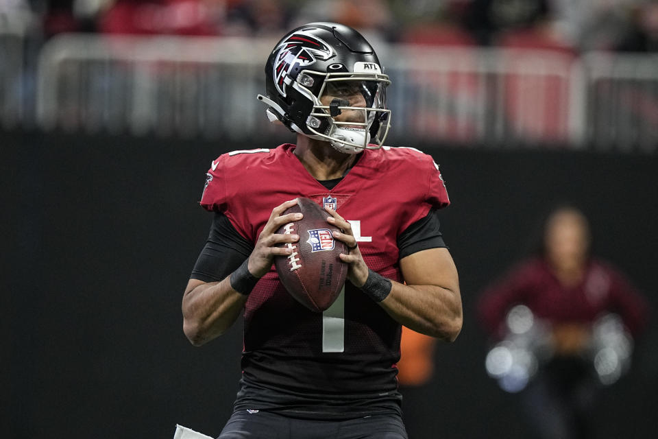 Atlanta Falcons quarterback Marcus Mariota (1) works in the pocket during the first half of an NFL football game against the Chicago Bears, Sunday, Nov. 20, 2022, in Atlanta. (AP Photo/Brynn Anderson)