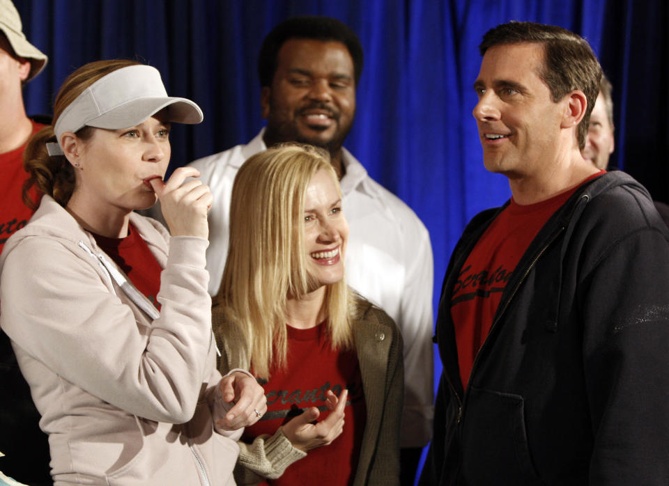 FILE - In this April 14, 2009, file photo cast members, from left, Jenna Fischer, Angela Kinsey, Craig Robinson, and Steve Carell are seen after cutting a cake celebrating the 100th episode of the television show "The Office" in Malibu, Calif. Netflix's announced that NBC's hit show "The Office" will be pulled from its lineup after 2020 and head to NBCUniversal's upcoming service. In a tweet Tuesday, June 25, Netflix said it was "sad" that NBC was taking back the show but added it will still be on Netflix for the next year and a half (AP Photo/Matt Sayles, File)