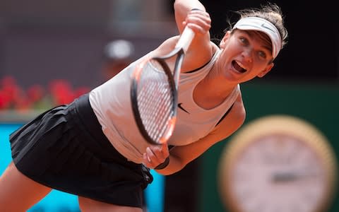 Simona Halep sends down a serve - Credit: Getty Images