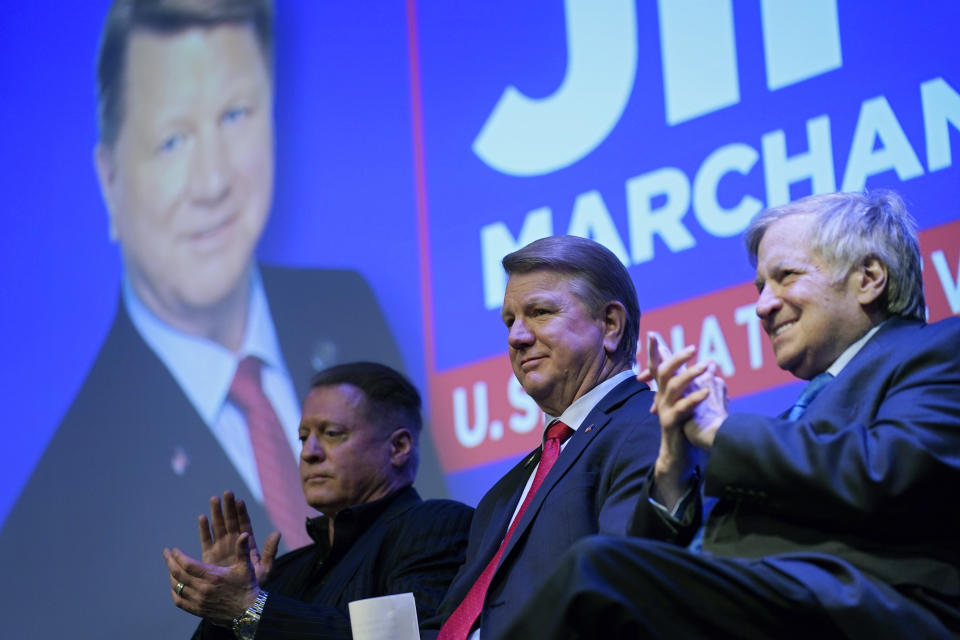 Jim Marchant, center, waits to speak at an event to announce his candidacy for the U.S Senate seat in Nevada, Tuesday, May 2, 2023, in Las Vegas. (AP Photo/John Locher)