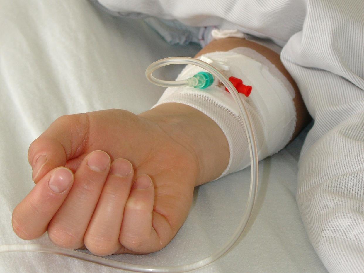 child hand in hospital