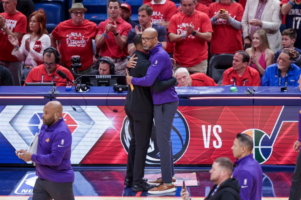 New Orleans Pelicans head coach Willie Green hugs Phoenix Suns head coach Monty Williams after game six of the first round for the 2022 NBA playoffs at Smoothie King Center.